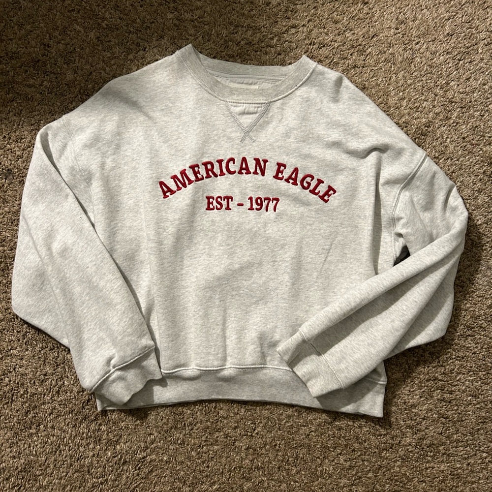 american eagle heather grey crewneck with red lettering